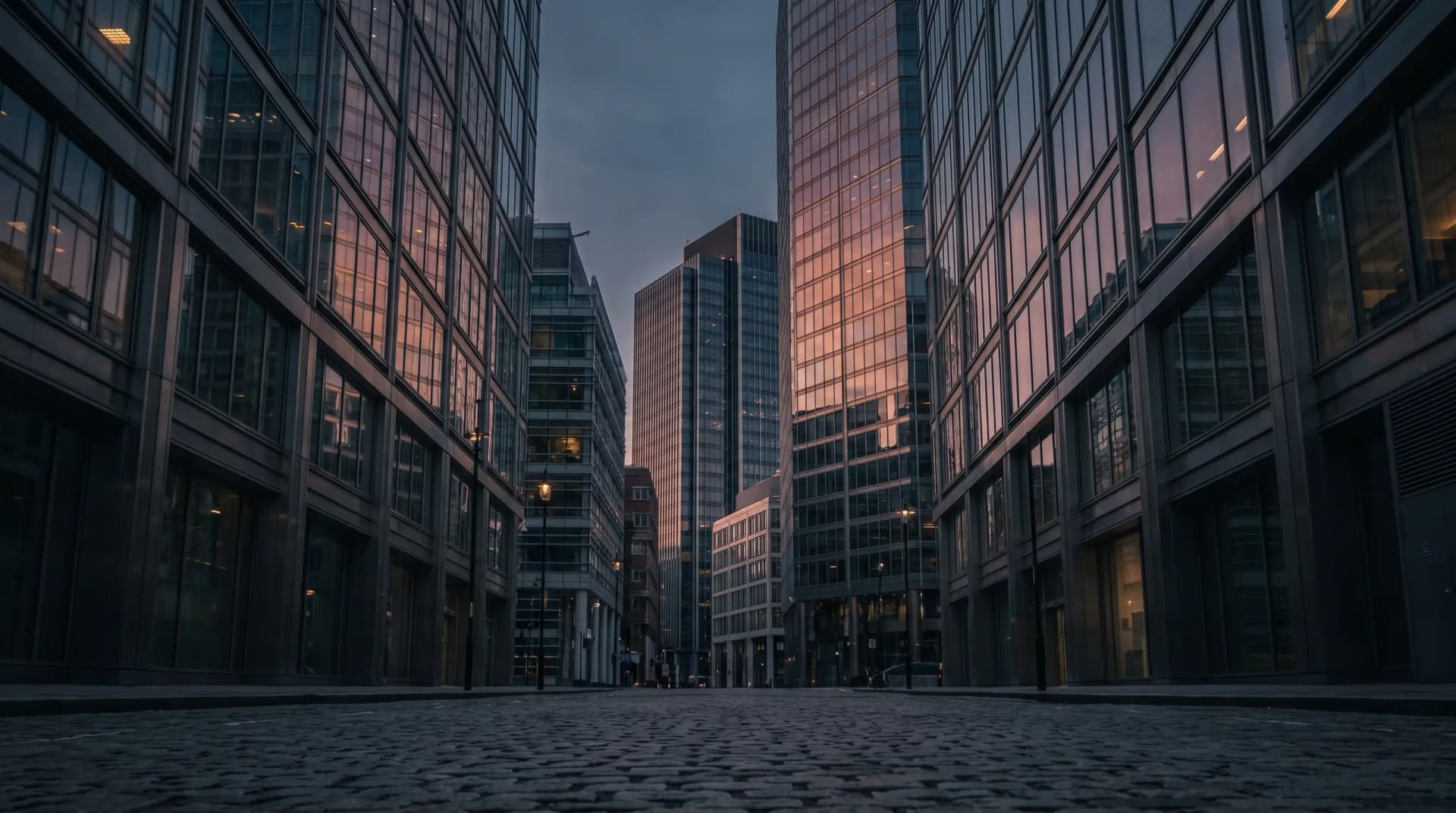 Glass office towers at dusk seen from below